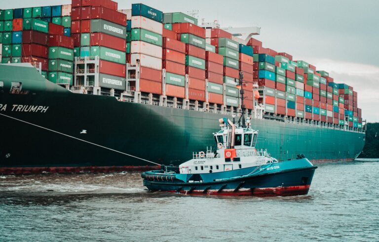 A container ship and a smaller boat next to it representing a guide to future-proofing your supply chain
