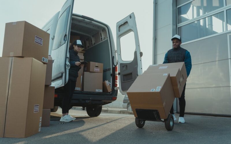 Man and Woman unloading Van