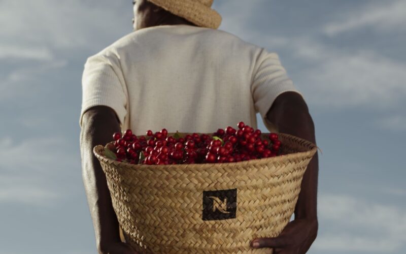 Man holding basket of fruit